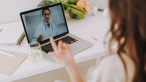 Woman making video call to her personal family doctor